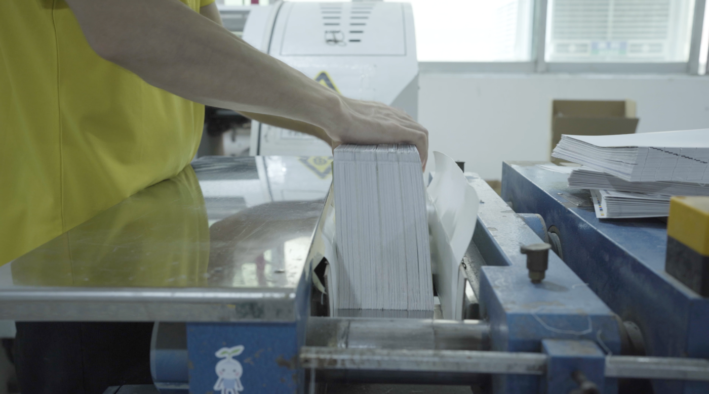 A printer works on binding the book Designing the Computational Image, Imagining Computational Design.